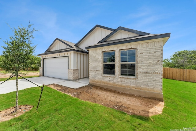 10314 Tule Creek Frk, San Antonio, TX 78252 - view of front of house featuring board and batten siding, concrete driveway, brick siding, and an attached garage