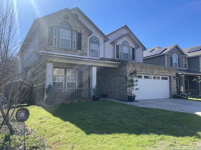 traditional home featuring driveway, a porch, an attached garage, a front lawn, and brick siding