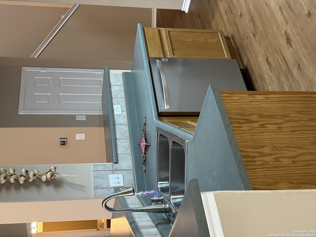 kitchen featuring brown cabinetry