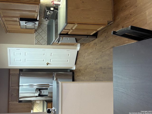 kitchen featuring stainless steel fridge