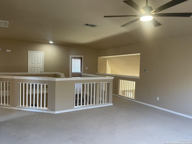 hallway with carpet floors, baseboards, visible vents, and recessed lighting