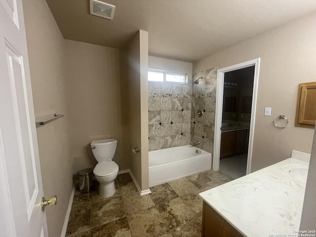 full bath with toilet, bathing tub / shower combination, vanity, visible vents, and baseboards