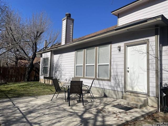 view of patio with entry steps and fence