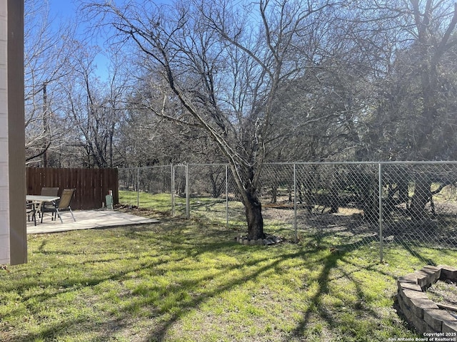 view of yard with a patio and fence