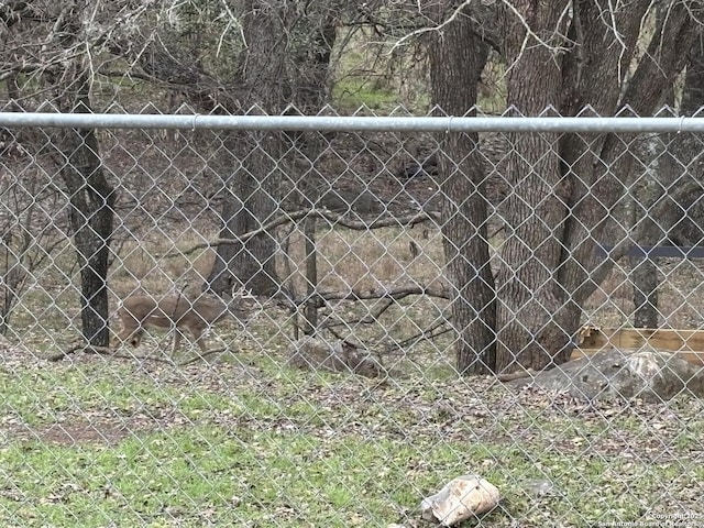 view of gate with fence