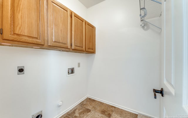 clothes washing area with washer hookup, hookup for a gas dryer, cabinet space, hookup for an electric dryer, and baseboards