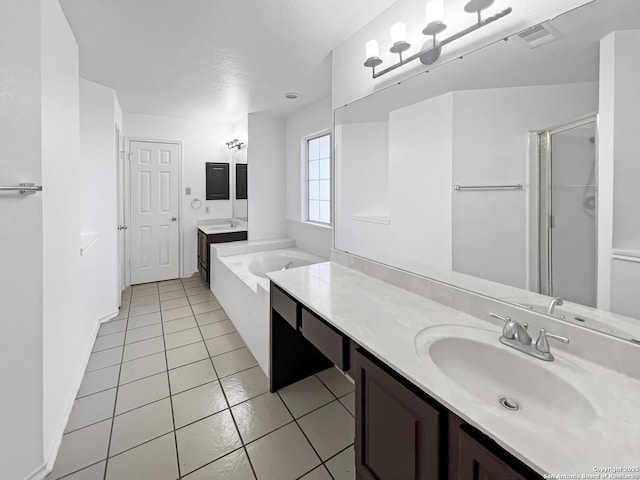 full bathroom featuring a sink, a stall shower, visible vents, and two vanities