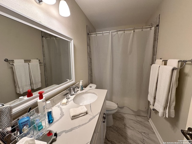 bathroom featuring toilet, marble finish floor, baseboards, and vanity