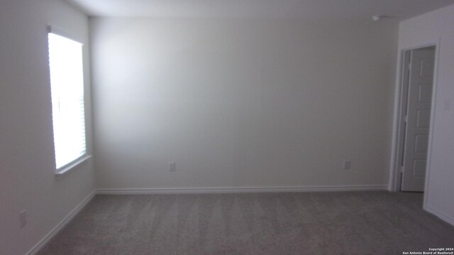 10643 W Military, San Antonio, TX 78251 - unfurnished room featuring dark colored carpet and baseboards