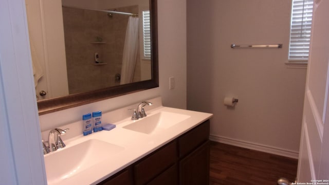 10643 W Military, San Antonio, TX 78251 - bathroom featuring a shower with shower curtain, a sink, baseboards, and double vanity