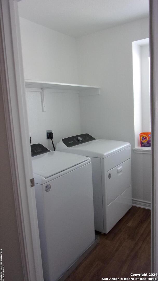 10643 W Military, San Antonio, TX 78251 - laundry room with dark wood-style floors, laundry area, and separate washer and dryer
