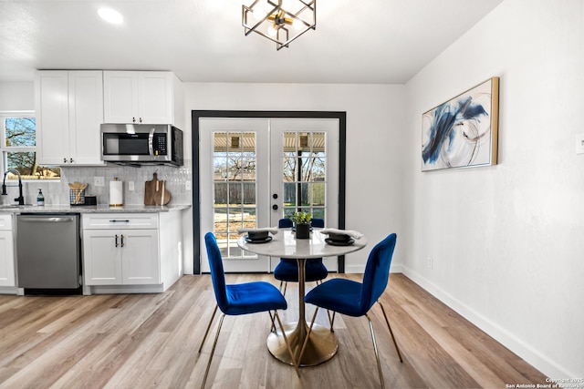 dining area featuring french doors, recessed lighting, light wood-style floors, and baseboards