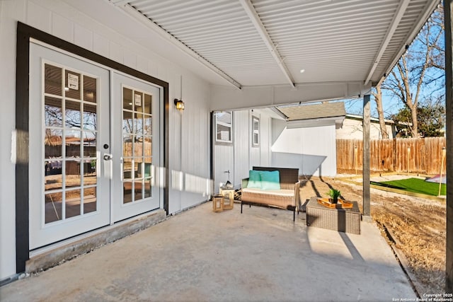 view of patio / terrace with fence and french doors