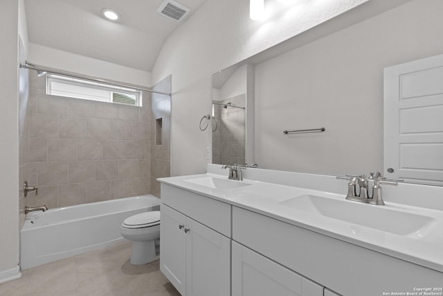 bathroom featuring shower / bath combination, visible vents, a sink, and double vanity