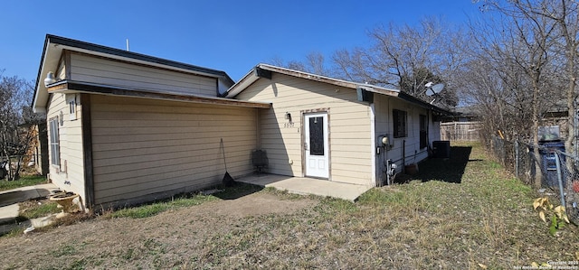 rear view of property with fence