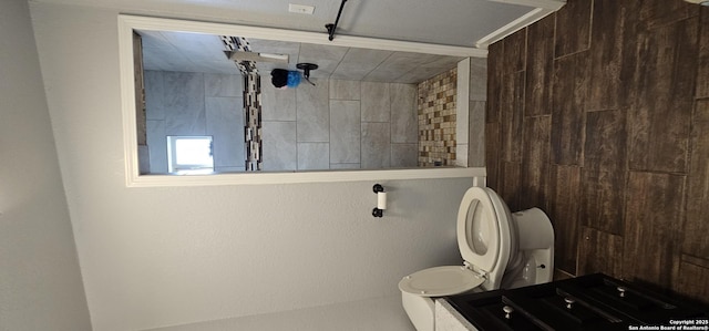 bathroom featuring toilet and a shower
