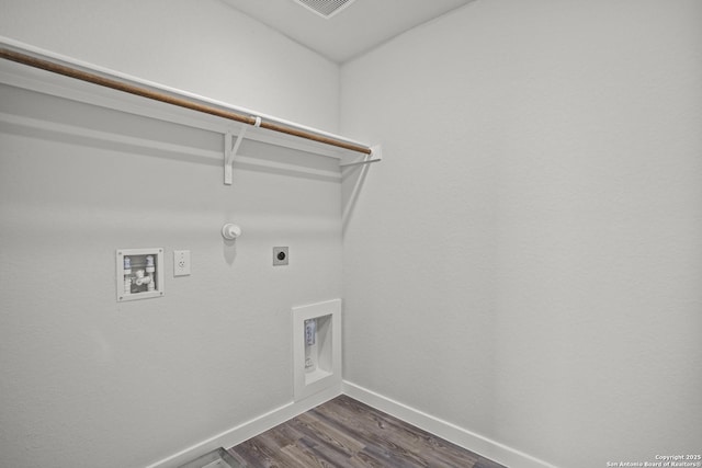 laundry room featuring baseboards, hookup for an electric dryer, hookup for a washing machine, dark wood-type flooring, and hookup for a gas dryer