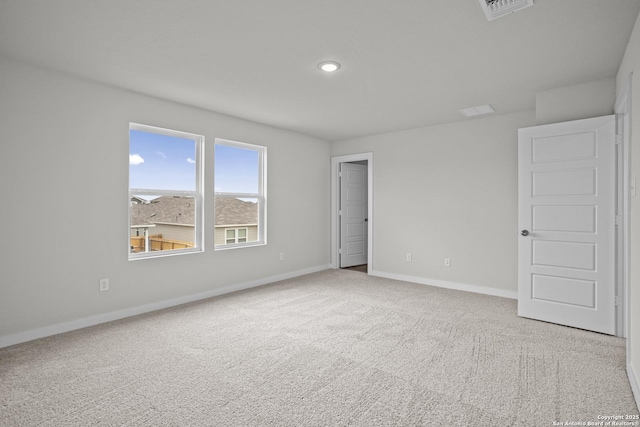 unfurnished room featuring baseboards, carpet floors, and recessed lighting