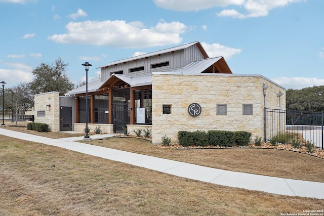 view of building exterior featuring fence