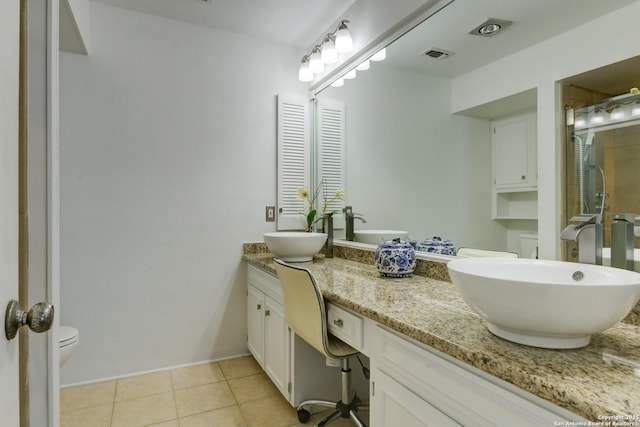 full bathroom with a sink, visible vents, a shower stall, tile patterned floors, and double vanity