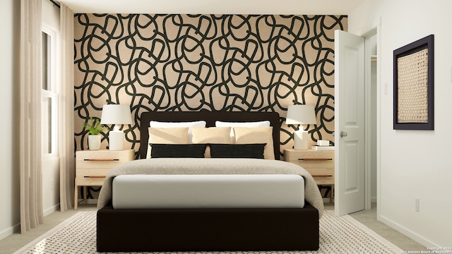 bedroom featuring wallpapered walls, an accent wall, baseboards, and light colored carpet