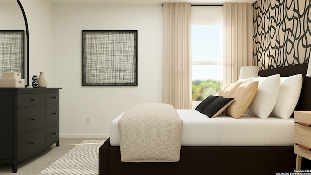 bedroom featuring light colored carpet and baseboards