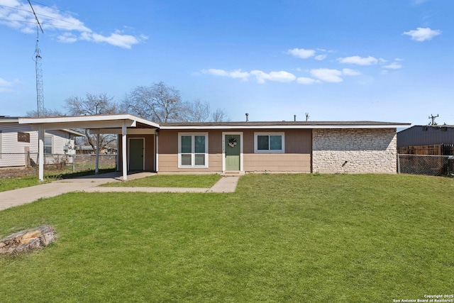 single story home with stone siding, fence, a carport, and a front yard