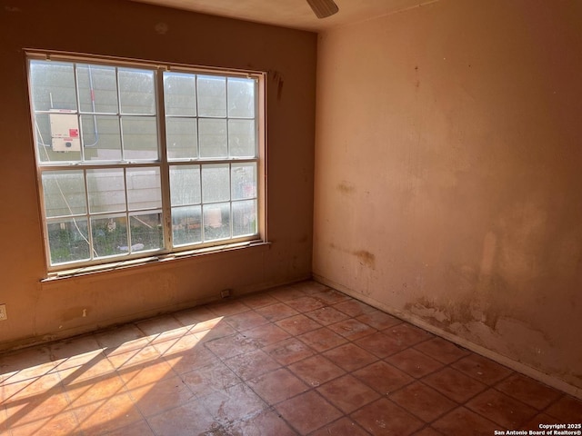 spare room with a ceiling fan