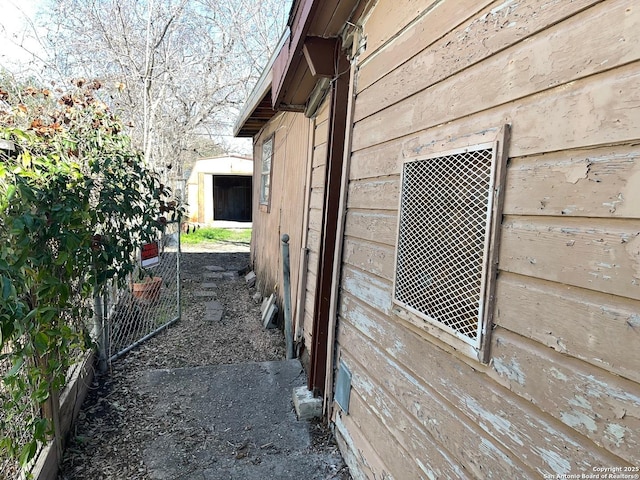 view of property exterior with an outbuilding