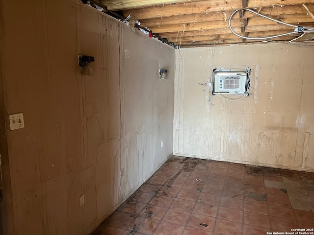 basement featuring an AC wall unit