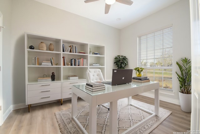 office area with ceiling fan, light wood-type flooring, and baseboards