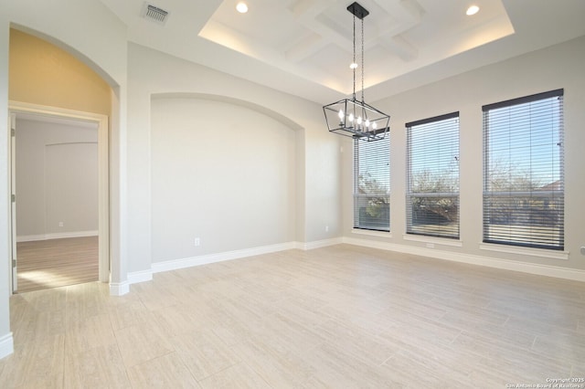 unfurnished dining area with baseboards, visible vents, coffered ceiling, and recessed lighting