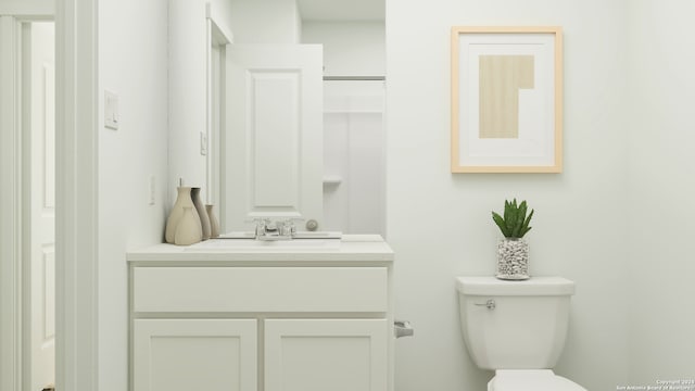 bathroom with toilet and vanity