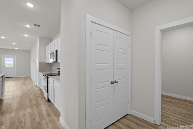 4338 Clarisse St, New Braunfels, TX 78130 - hall with light wood-style floors, baseboards, and recessed lighting