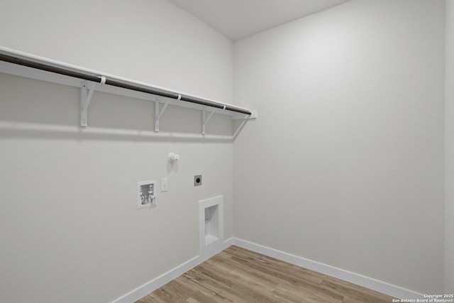 4338 Clarisse St, New Braunfels, TX 78130 - washroom with hookup for an electric dryer, baseboards, light wood-style floors, washer hookup, and hookup for a gas dryer
