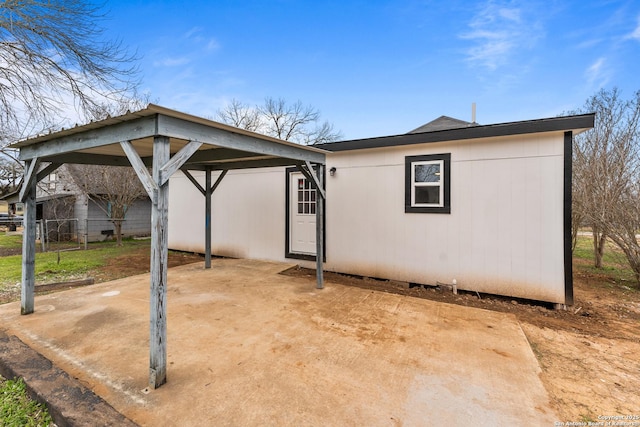 exterior space with fence and a detached carport