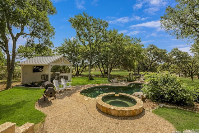 view of patio / terrace with a pool with connected hot tub