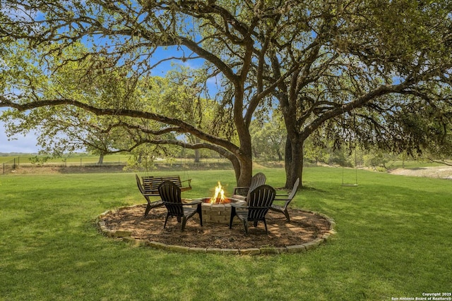 view of yard with an outdoor fire pit