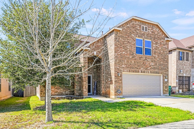 traditional-style house with a garage, a front yard, concrete driveway, and brick siding