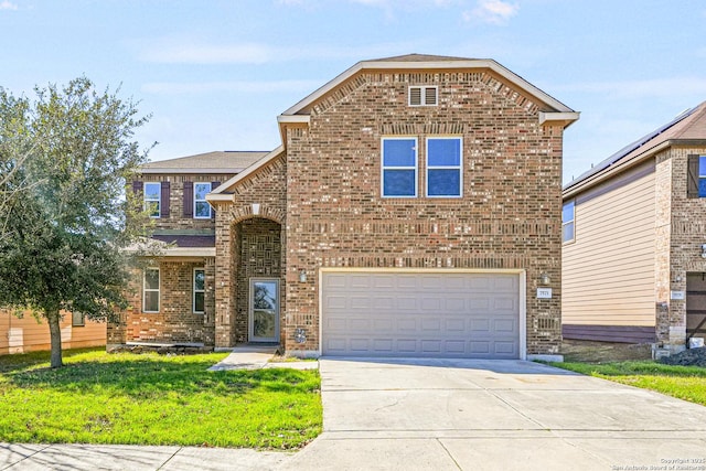 traditional-style home with a garage, concrete driveway, brick siding, and a front lawn