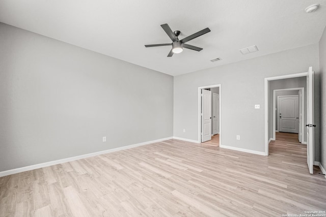 unfurnished bedroom with a ceiling fan, visible vents, light wood-style flooring, and baseboards