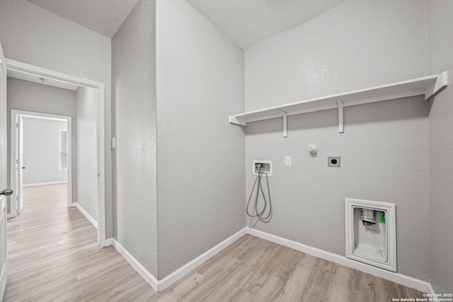 washroom with laundry area, hookup for a gas dryer, light wood-type flooring, and hookup for an electric dryer