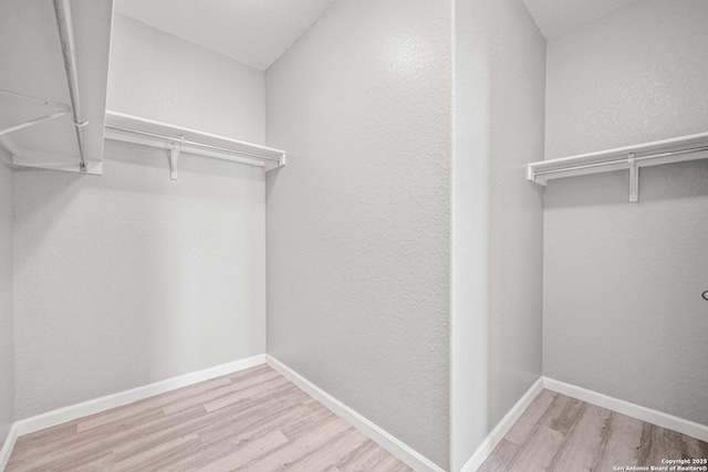 walk in closet featuring light wood-type flooring