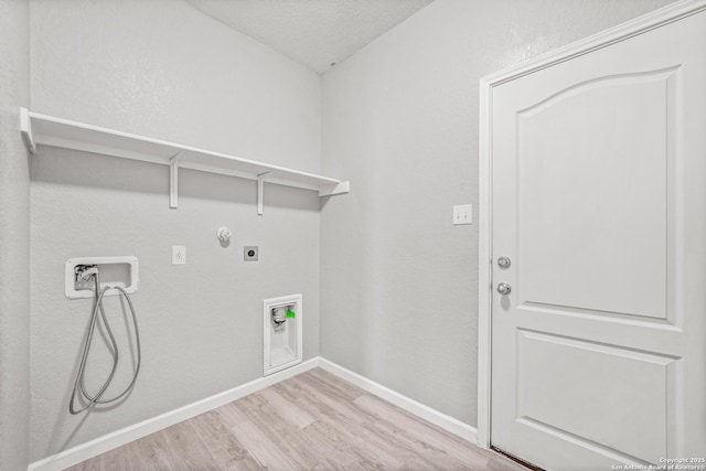 laundry room with hookup for a washing machine, light wood-style flooring, hookup for an electric dryer, laundry area, and baseboards