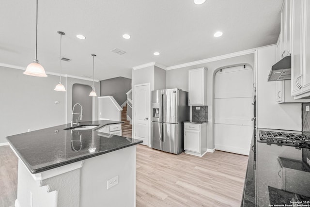 kitchen featuring under cabinet range hood, white cabinetry, pendant lighting, and stainless steel fridge with ice dispenser