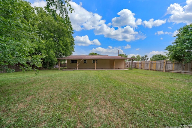 view of yard with a fenced backyard and a patio