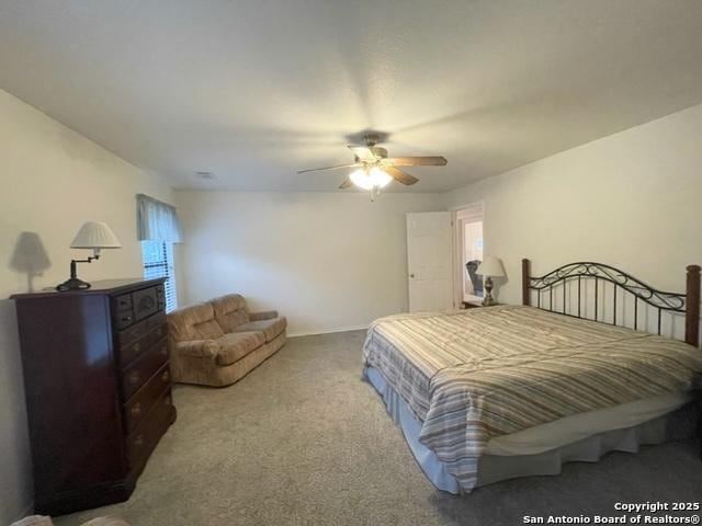 bedroom featuring ceiling fan and light colored carpet