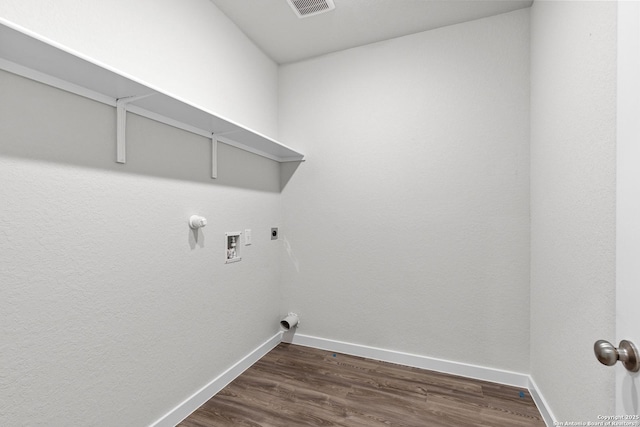 clothes washing area with laundry area, baseboards, dark wood-style floors, and visible vents