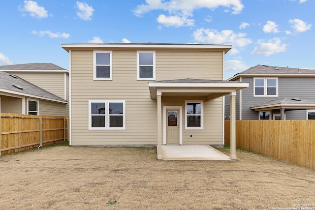 back of house with a patio area and a fenced backyard