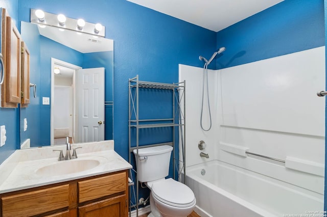 bathroom with toilet, tub / shower combination, and vanity